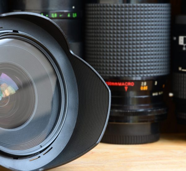 Professional photographic art equipment. Assortment of modern lenses Professional photo art equipment. Assortment of modern lenses. Thematically for the sale or rental of photographic equipment and the presentation of photo lessons